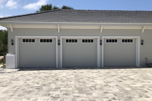 Stamped Shaker Garage Doors with Glass Top Sections and Madison Inserts.