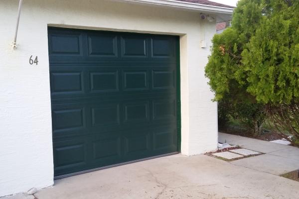 Raised Short Panel Garage Door in Evergreen