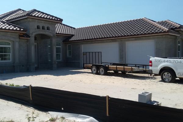 truck with trailer near house