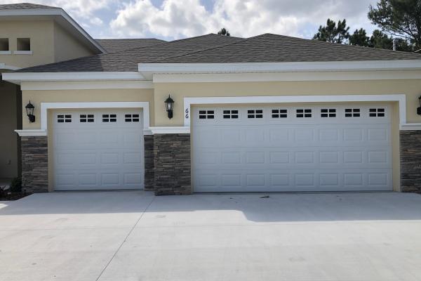 CHI Raised Short Panel Garage Doors with Plain Glass Top Sections And Stockton Inserts. 