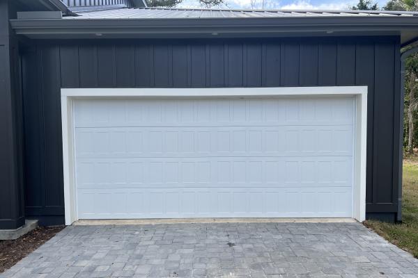 New construction home with the clean lines of a CHI Stamped Shaker Garage Door.