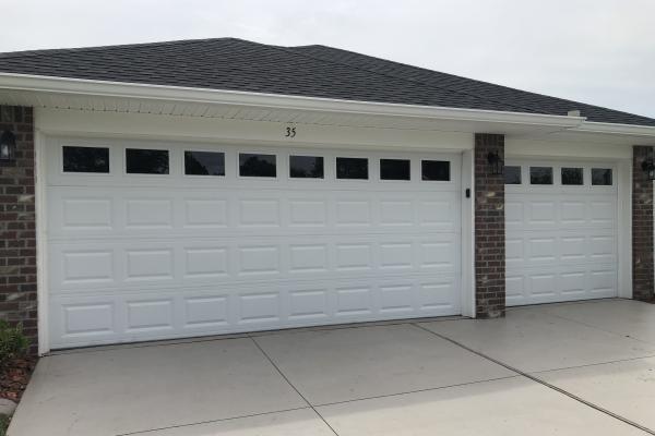 Customer wanted upgraded garage doors so they chose the CHI 2251 in white with Plain Glass Top Section without Inserts.