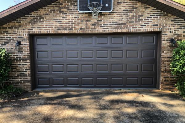 Homeowners wanted to update their garage door while still keeping a simple classic look, they went with a CHI model 2250 in brown. 