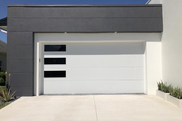 Skyline Flush Garage Door with Oversized Tinted Windows.