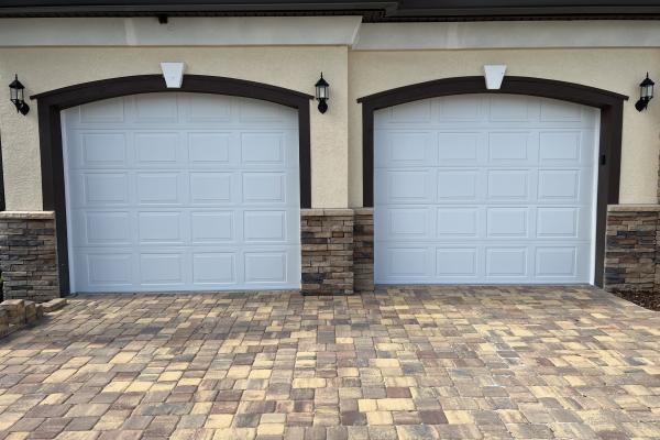 New construction home with Raynor Buildmark Garage Doors in Raised Short Panel Design 