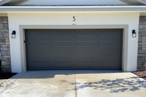 New construction home with CHI raised long panel garage door.