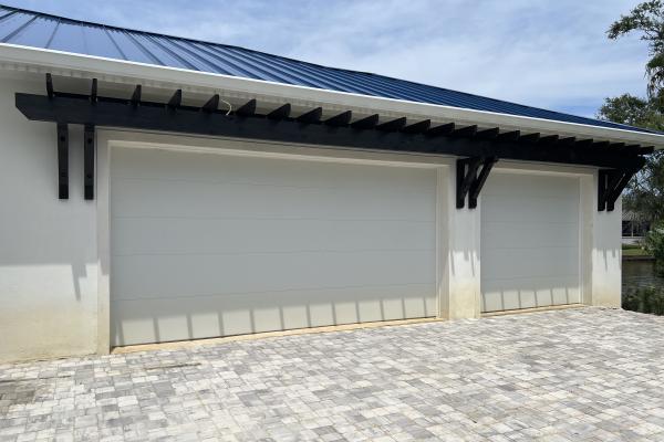 New construction home with two CHI 2150 Flush garage doors installed.