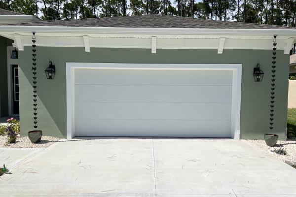Recently constructed home with a flush design garage door.