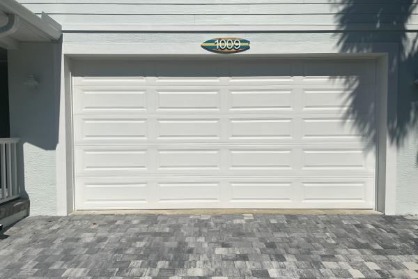Recent new build with a Raised Long Panel Garage Door.