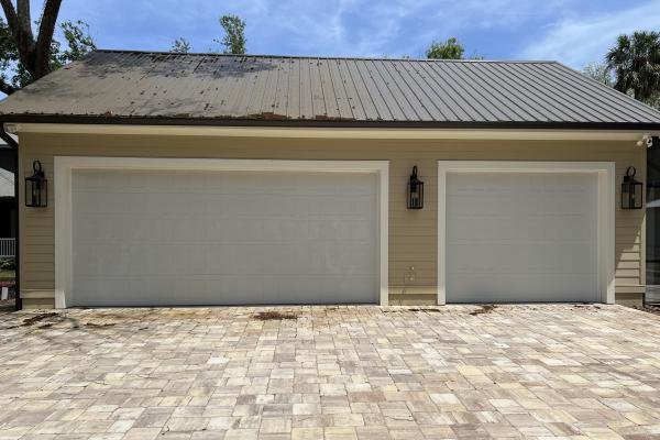 New Home with Stamped Shaker style garage doors.