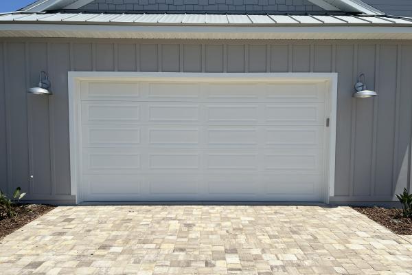 Recently built home utilizing the classic look of a Raised Long Panel Garage Door. 