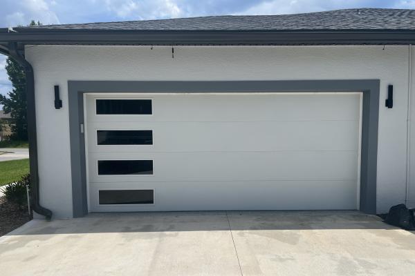Newly constructed contemporary home that needed garage doors to match. These customers chose the CHI Skyline series complete the look. 