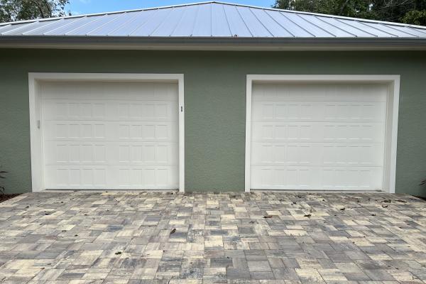 Recently constructed home with Stamped Shaker garage doors