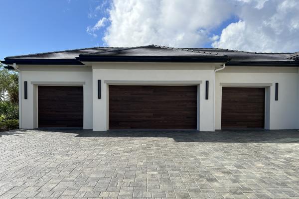 CHI Accents Planks Garage Doors in Dark Oak installed by ABS Garage Doors in Palm Coast, Florida