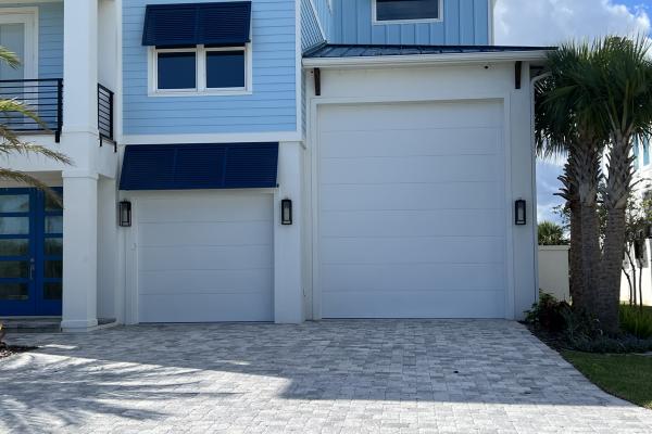 CHI Model 2150 / 2151 Flush Garage Doors installed by ABS Garage Doors in Flagler Beach, Florida.