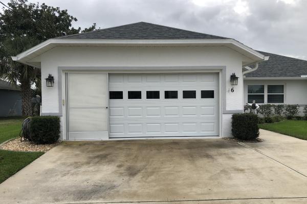 Raised Short Panel Garage Door with Plain Glass