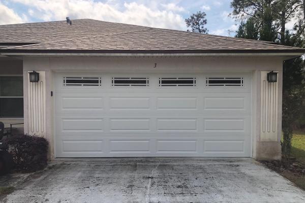 Customers wanted a new garage door that was different than what their neighbors have. They chose CHI model 4250 / 4251 with a glass top section and prairie inserts.