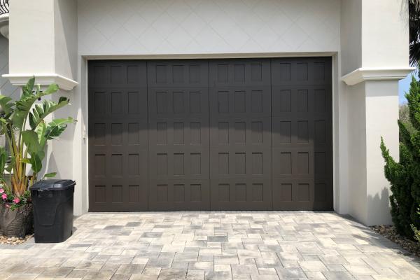 Customer needed an oversized garage door with a unique look. They chose a stamped shaker garage door.