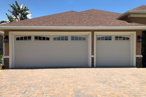 Customer wanted to upgrade their standard builder grade garage doors to a door with a high R value and glass to they could have some light in the garage.