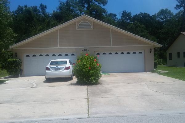Raised Short Panel Garage Doors with Cathedral Glass Top Section