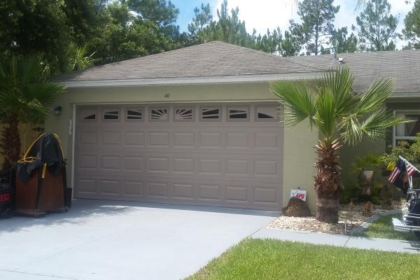 Raised Short Panel Garage Door with Sunburst Design Glass Top Section