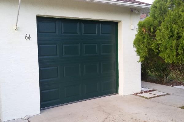 Raised Short Panel Garage Door in Evergreen