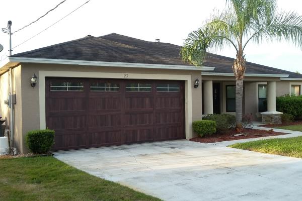 Accents Mahogany Carriage Stamp Long Panel Garage Door with Hampton Frosted Glass