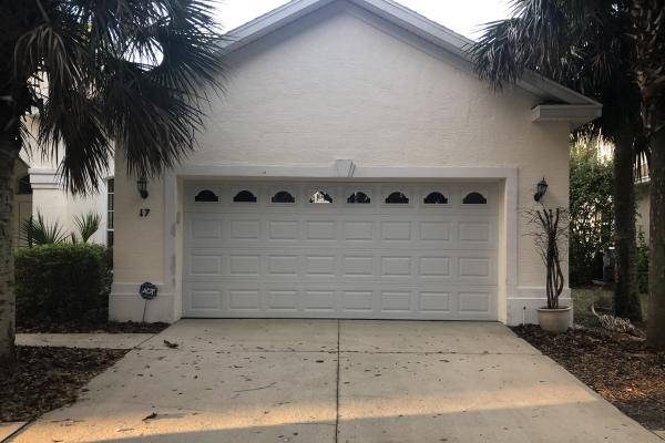 Raised Short Panel Garage Door with Glass Top Section and Cathedral Inserts