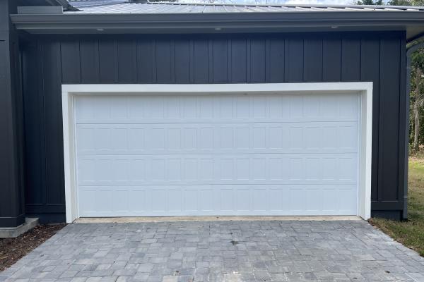 CHI Model 2550 Stamped Shaker Garage Door installed by ABS Garage Doors on a new construction home located in The Hammock, Palm Coast Florida