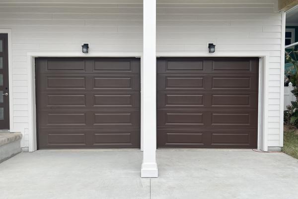 CHI model 4250 raised long panel garage door in brown installed by ABS Garage Doors in Flagler Beach, Florida