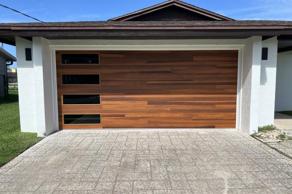 C.H.I model 2347 Series Skyline garage door in Accents Cedar Color installed by ABS Garage Doors in Palm Coast, Florida