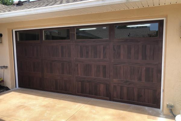 CHI 5983 Accents garage door with glass top section installed by ABS Garage Doors Palm Coast, Florida